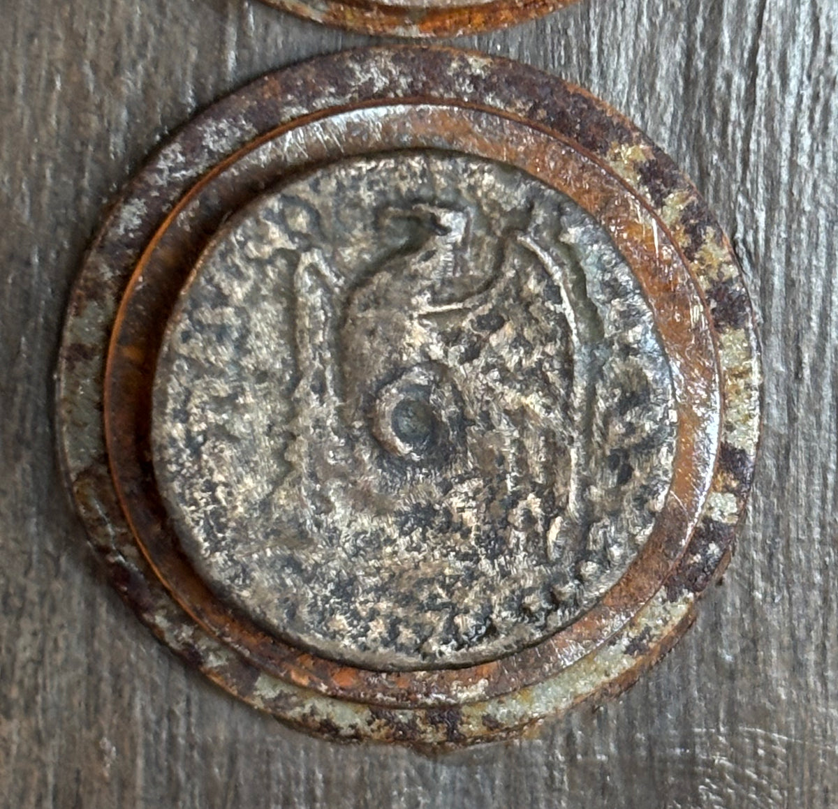 The lower ancient Egypt coin is dated from 305 to 330 BC.