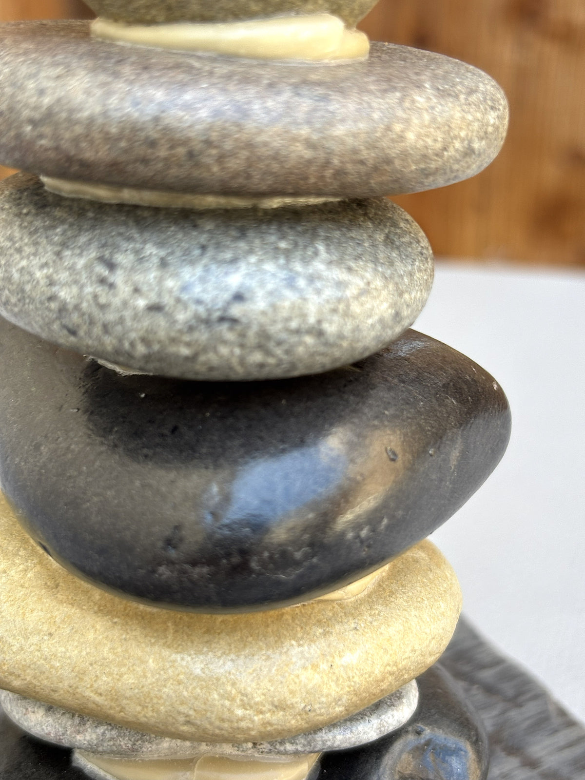 A detail look at four river rocks in a small scultpure.
