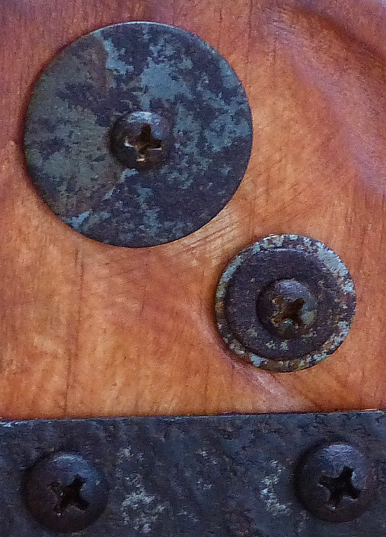 a close-up view of the original sculpture by Robert Schott titled Twine and Steel showing aged metal