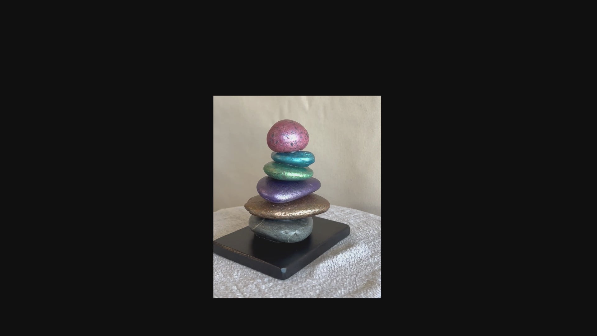 Short video of a jeweled tone river rock sculpture by Robert Schott