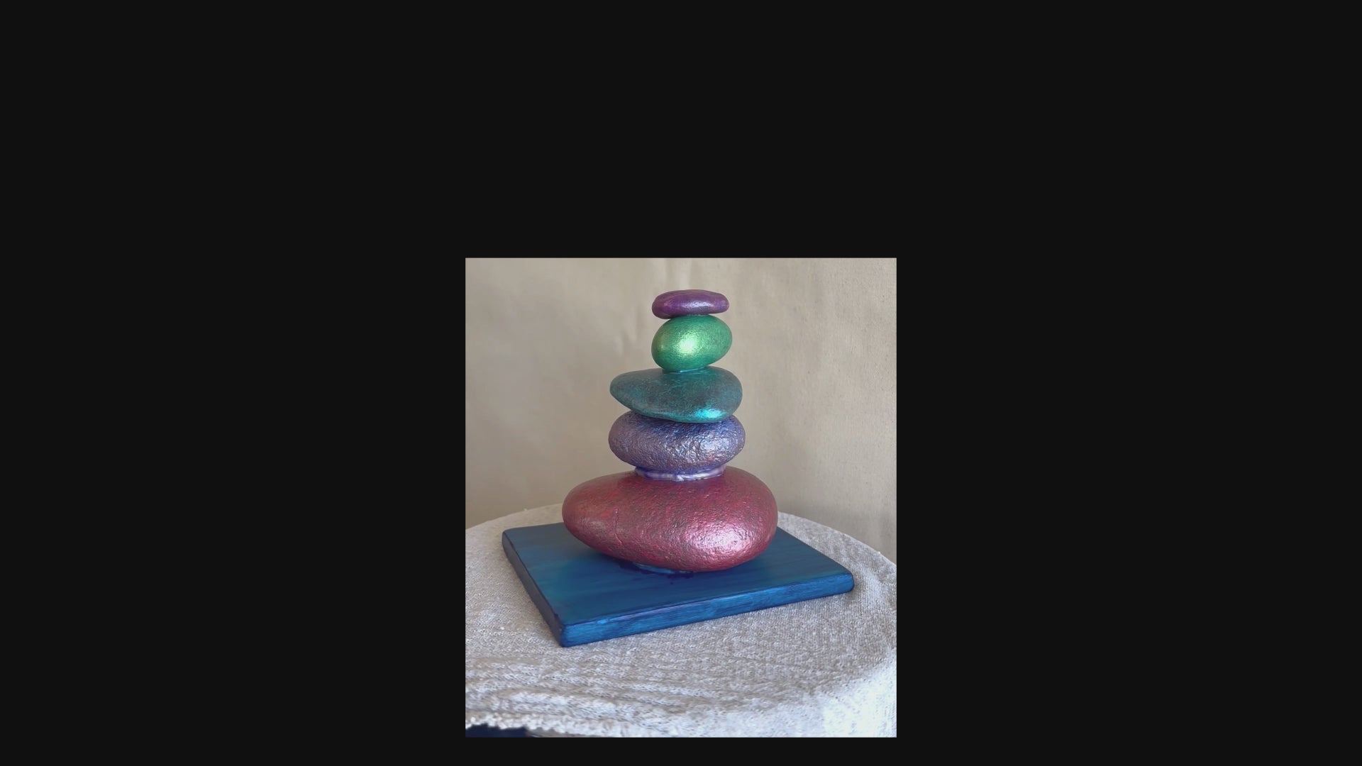 Short video of a rock sculpture turning around.