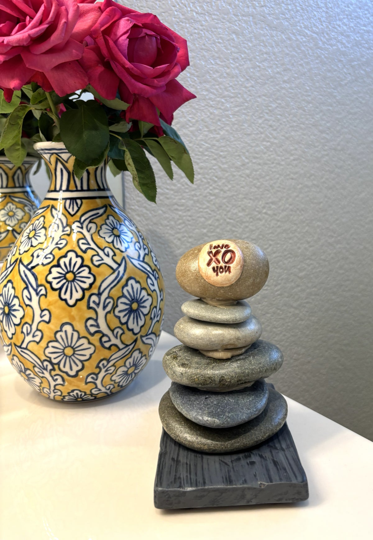 stacked river rock sculpture showing relative size