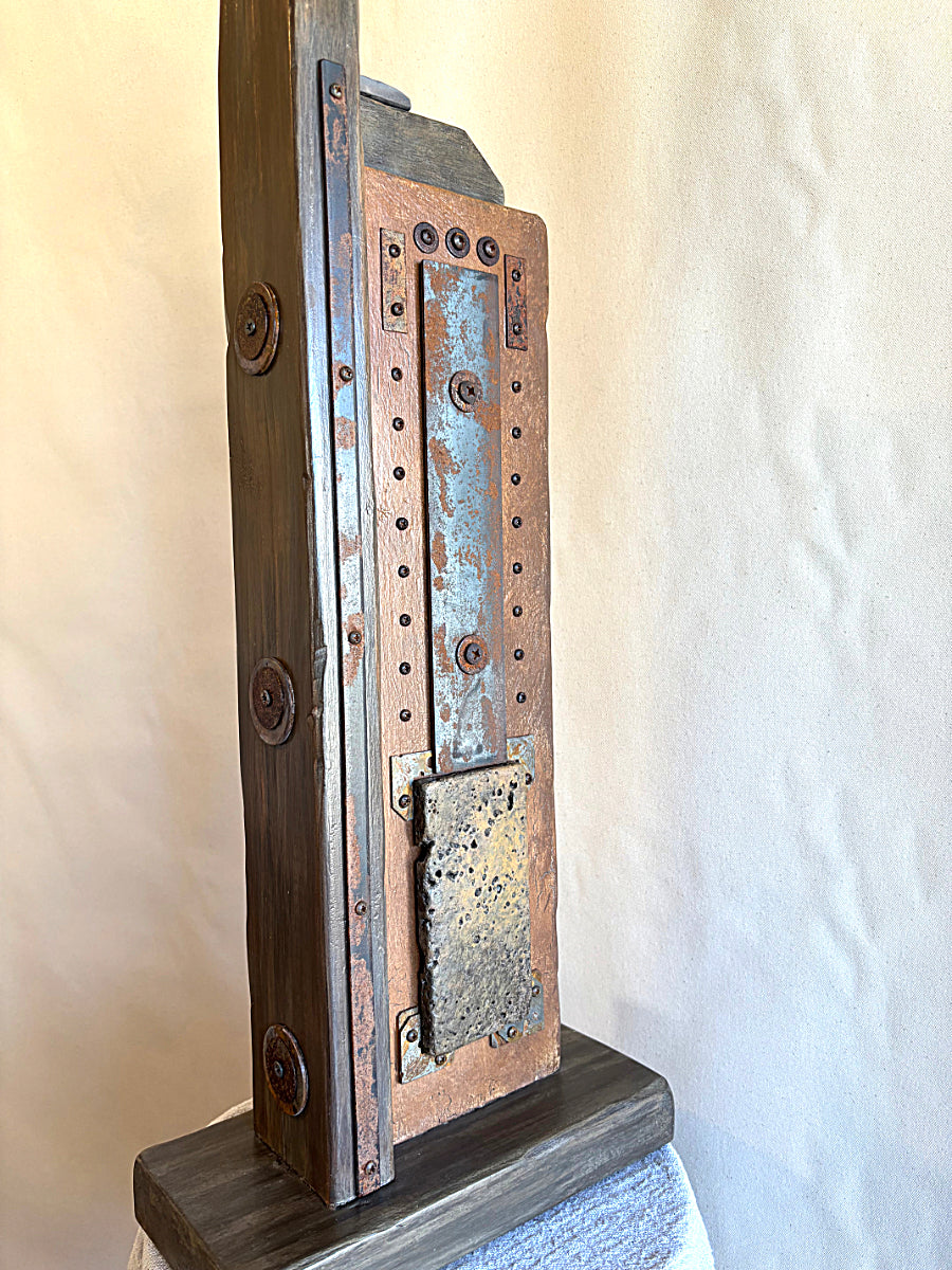 An angle view of this Wabi-Sabi inspired sculpture by Robert Schott titled Great Empires.