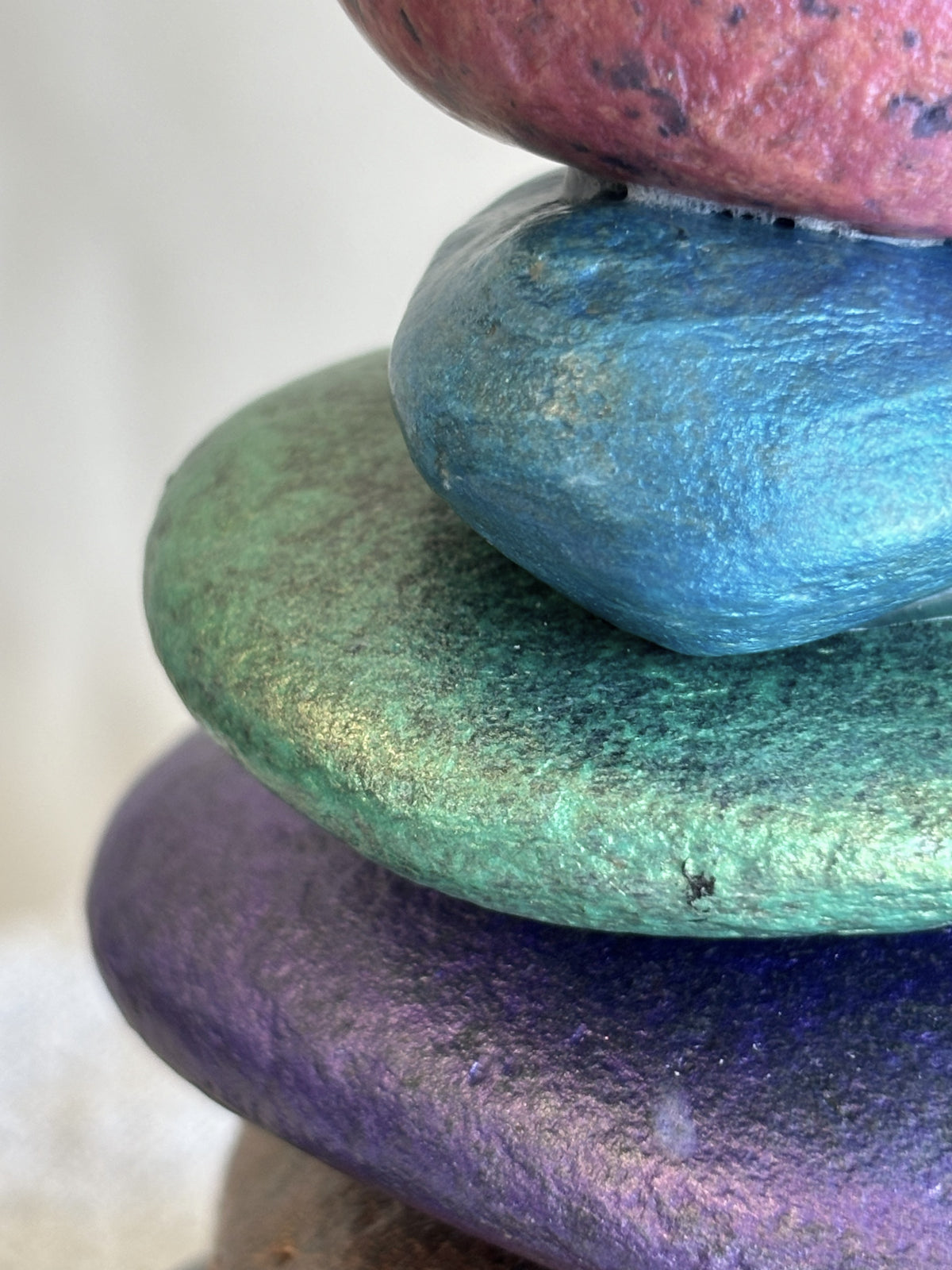Beautiful detail of jewel colored river rocks by Robert Schott