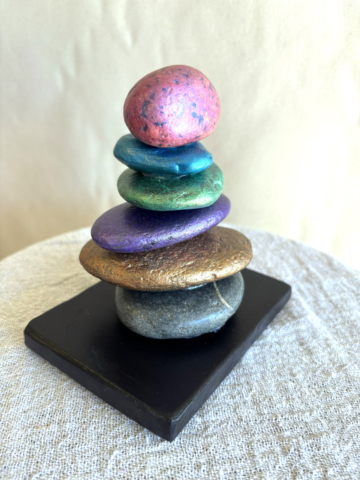 A river rock stacked sculpture by Robert Schott