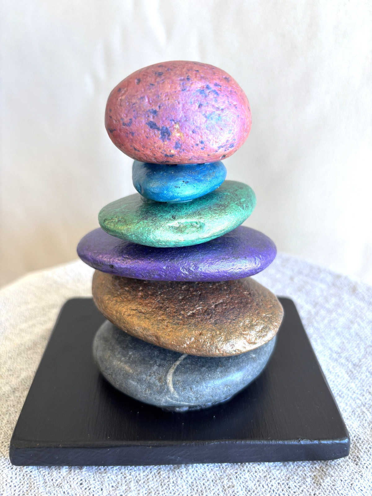 Stacked stone sculpture with six stones by Robert Schott