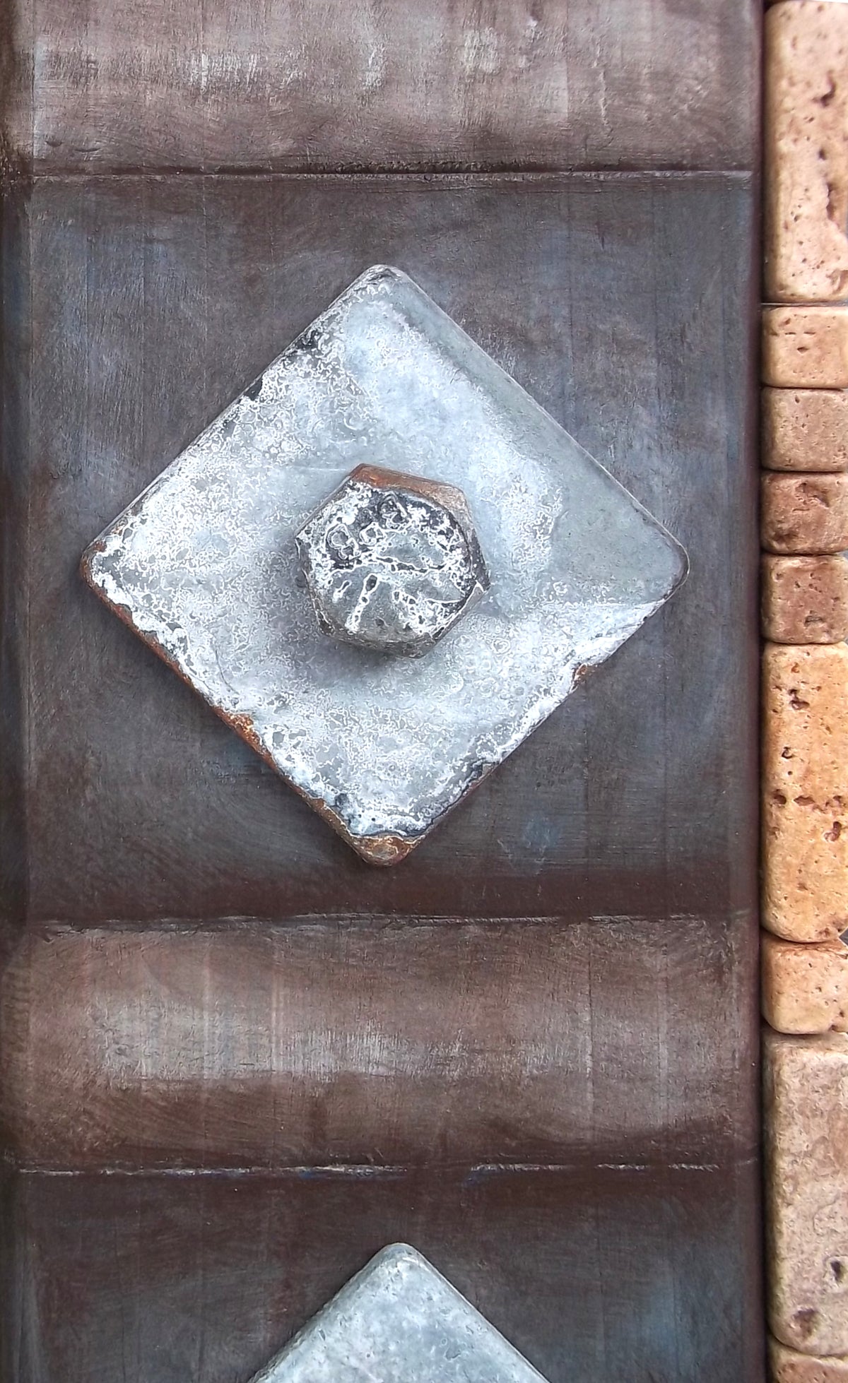 Closeup view of Steel a Wabi-Sabi found object sculpture by Robert Schott. It shows aged bolts and wood.