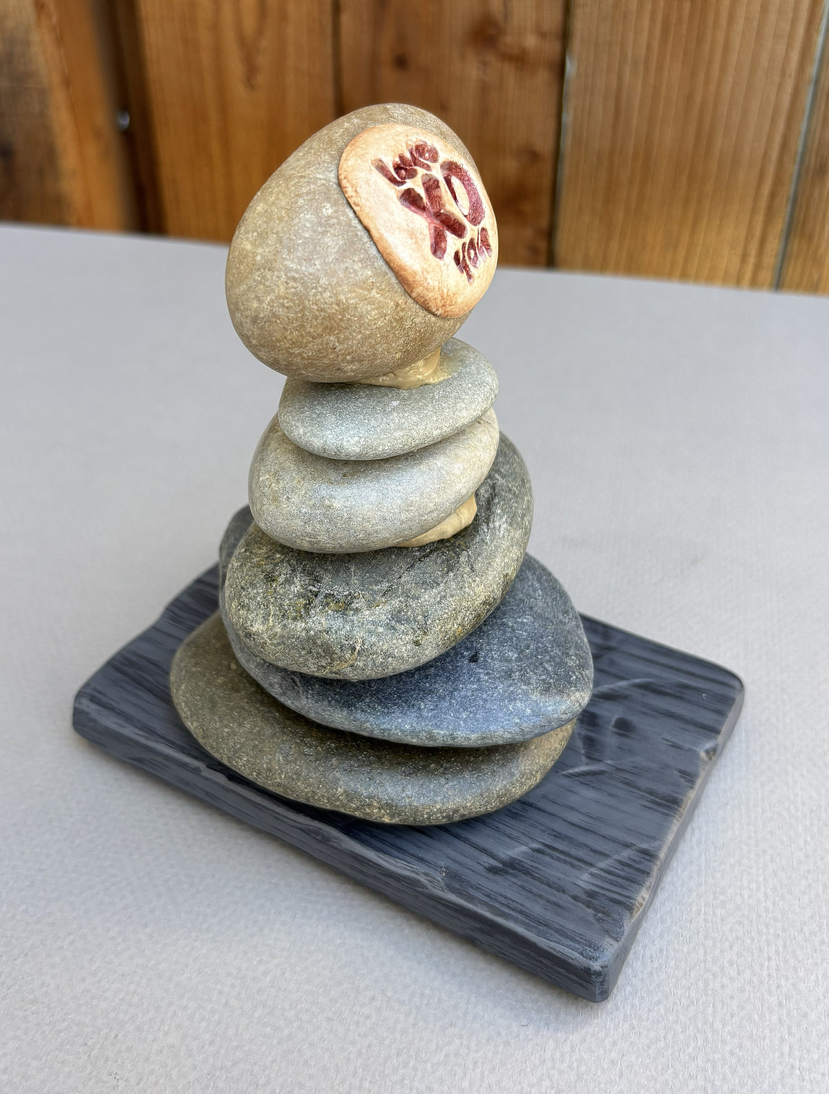 A stacked river rock sculpture by Robert Schott