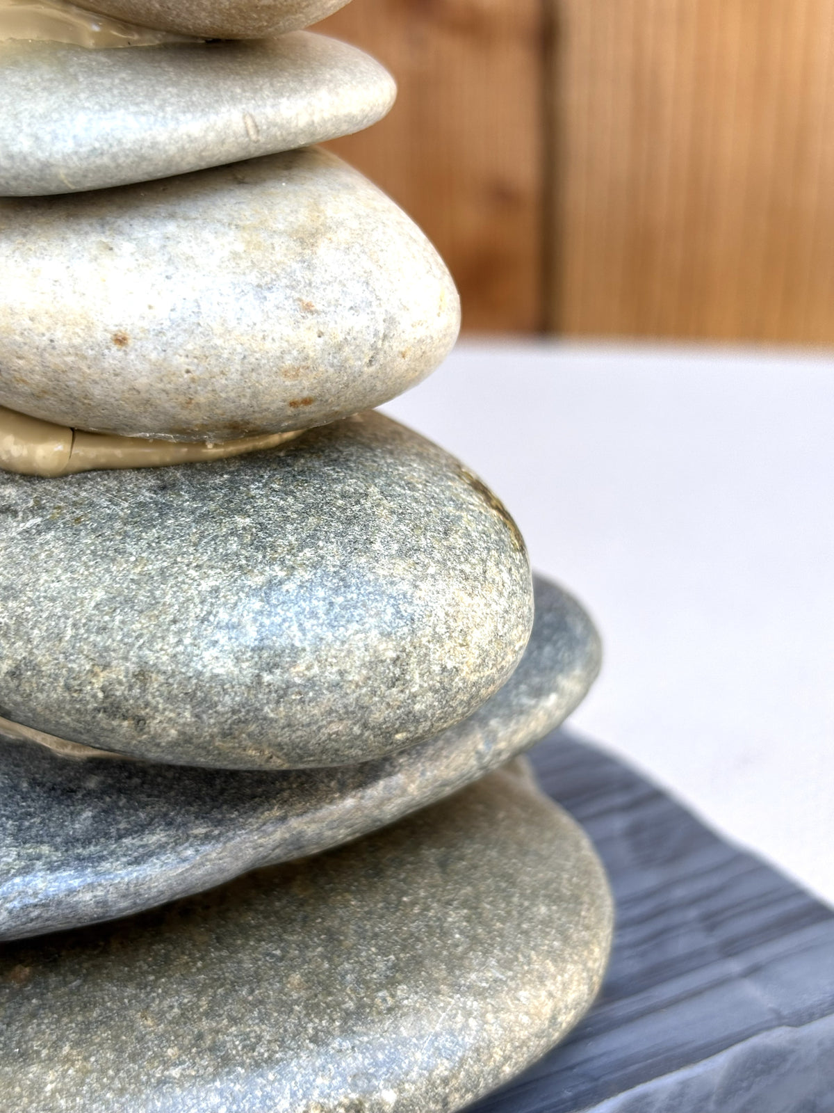 A detail of five stones from a cairn sculpture.